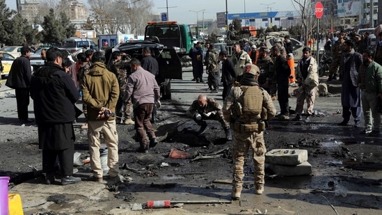 Security personnel inspect the site of a deadly bomb attack in Kabul, Afghanistan, Wednesday.(AP) Security personnel inspect the site of a deadly bomb attack in Kabul, Afghanistan, Wednesday.(AP)
