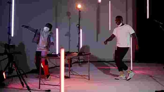 Artist Nathan Nzanga dances during a tech rehearsal with "Matondo," brother Daniel Nzanga, for 'Sessions In Place', a live-streamed socially distanced concert series, at Olympic Studios in Seattle, Washington, U.S., January 30, 2021.(REUTERS)