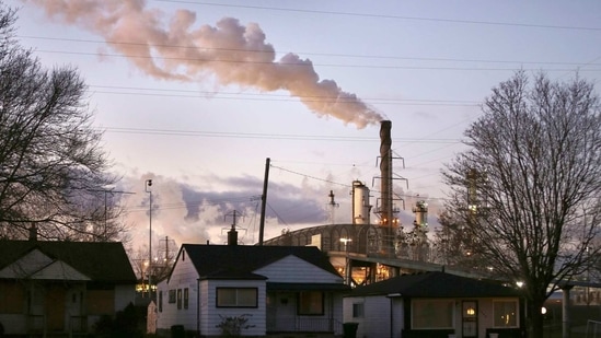Smoke billows from a Marathon Petroleum refinery near a neighborhood in southwest Detroit.(AP)
