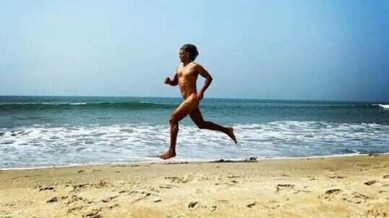 Milind Soman runs on the beach.