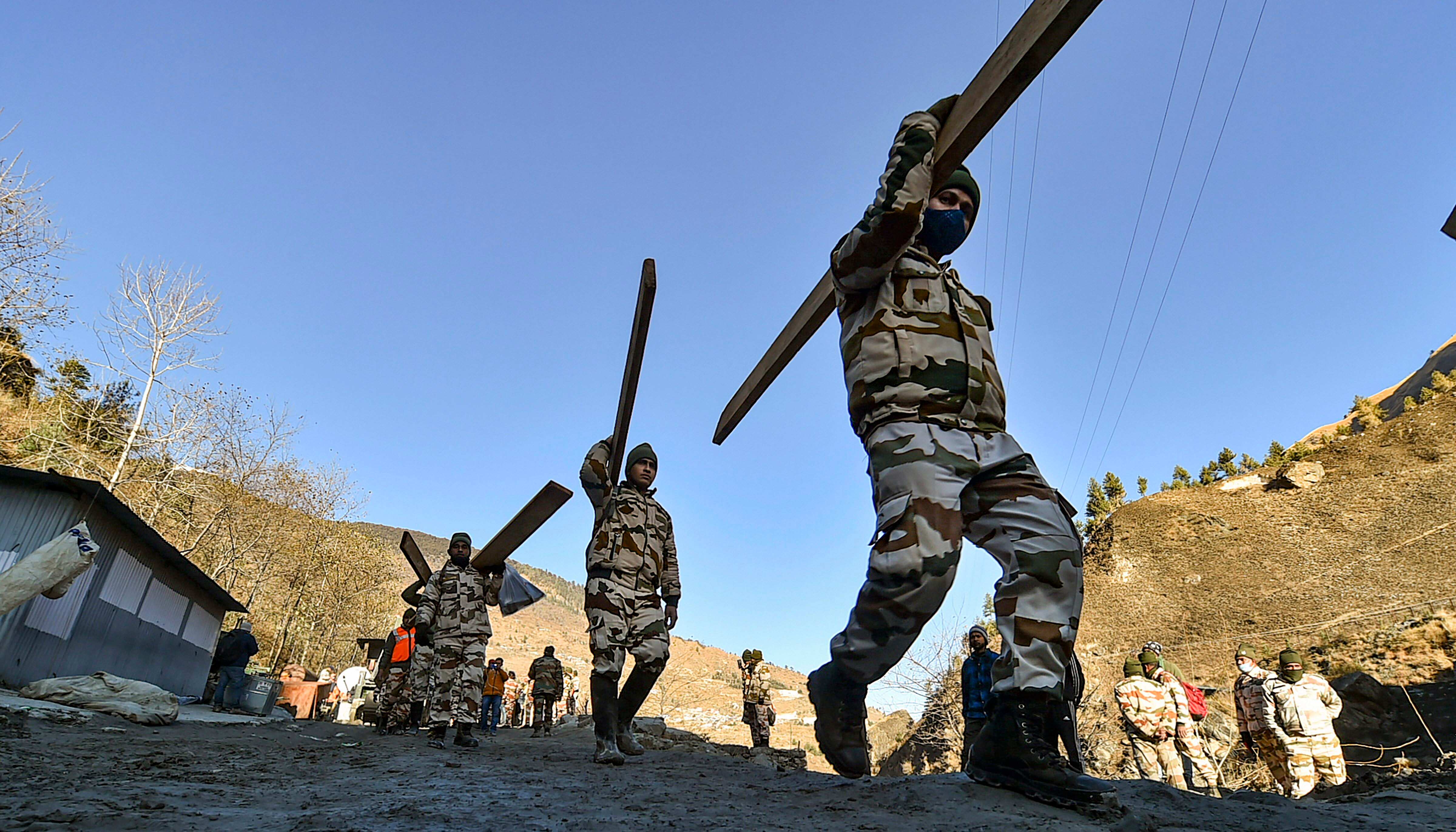 ITBP personnel at work during rescue operations in Chamoli on February 8. The police have issued a helpline number to provide information about bodies that have not been identified yet. "People, who know someone who is missing, can contact DIG Law and Order on +91 7500016666, they will be sent photos of 24 bodies that are yet to be identified, on WhatsApp," police said. (Arun Sharma / PTI) ITBP personnel at work during rescue operations in Chamoli on February 8. The police have issued a helpline number to provide information about bodies that have not been identified yet. "People, who know someone who is missing, can contact DIG Law and Order on +91 7500016666, they will be sent photos of 24 bodies that are yet to be identified, on WhatsApp," police said. (Arun Sharma / PTI)