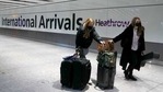 Travelers arrive at Heathrow Airport in London.(AP) Travelers arrive at Heathrow Airport in London.(AP)