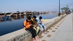 Kashmiri boys use mobile phones at banks of Dal lake after restoration of 4G mobile internet, in Srinagar on Saturday. (ANI Photo) Kashmiri boys use mobile phones at banks of Dal lake after restoration of 4G mobile internet, in Srinagar on Saturday. (ANI Photo)