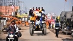 Farmers ride a tractor during the ongoing protest against the new farm laws at Singhu Border in New Delhi on Tuesday. (ANI Photo) Farmers ride a tractor during the ongoing protest against the new farm laws at Singhu Border in New Delhi on Tuesday. (ANI Photo)