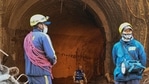 State Disaster Response Force (SDRF) personnel stand outside the entrance of Tapovan tunnel during rescue efforts in Uttarakhand's Chamoli district. (AFP) State Disaster Response Force (SDRF) personnel stand outside the entrance of Tapovan tunnel during rescue efforts in Uttarakhand's Chamoli district. (AFP)
