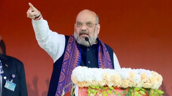 Amit Shah also announced a <span class='webrupee'>₹</span>500-crore cultural centre for the Rajbongshis, setting up a statue of Thakur Panchanan Barma, a Rajbongshi leader and a social reformer from Cooch Behar. (PTI PHOTO)