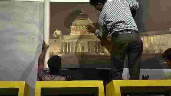 Workers give final touches to a kiosk at the Rashtrapati Bhavan Museum. The country’s only underground museum will be inaugurated by Prime Minister Narendra Modi on Monday and will open to the public on October 2. Apart from the artifacts, various censors are also installed in the museum which will help in protecting the possessions from lights that cause discoloration. (Raj K Raj/HT Photo) 