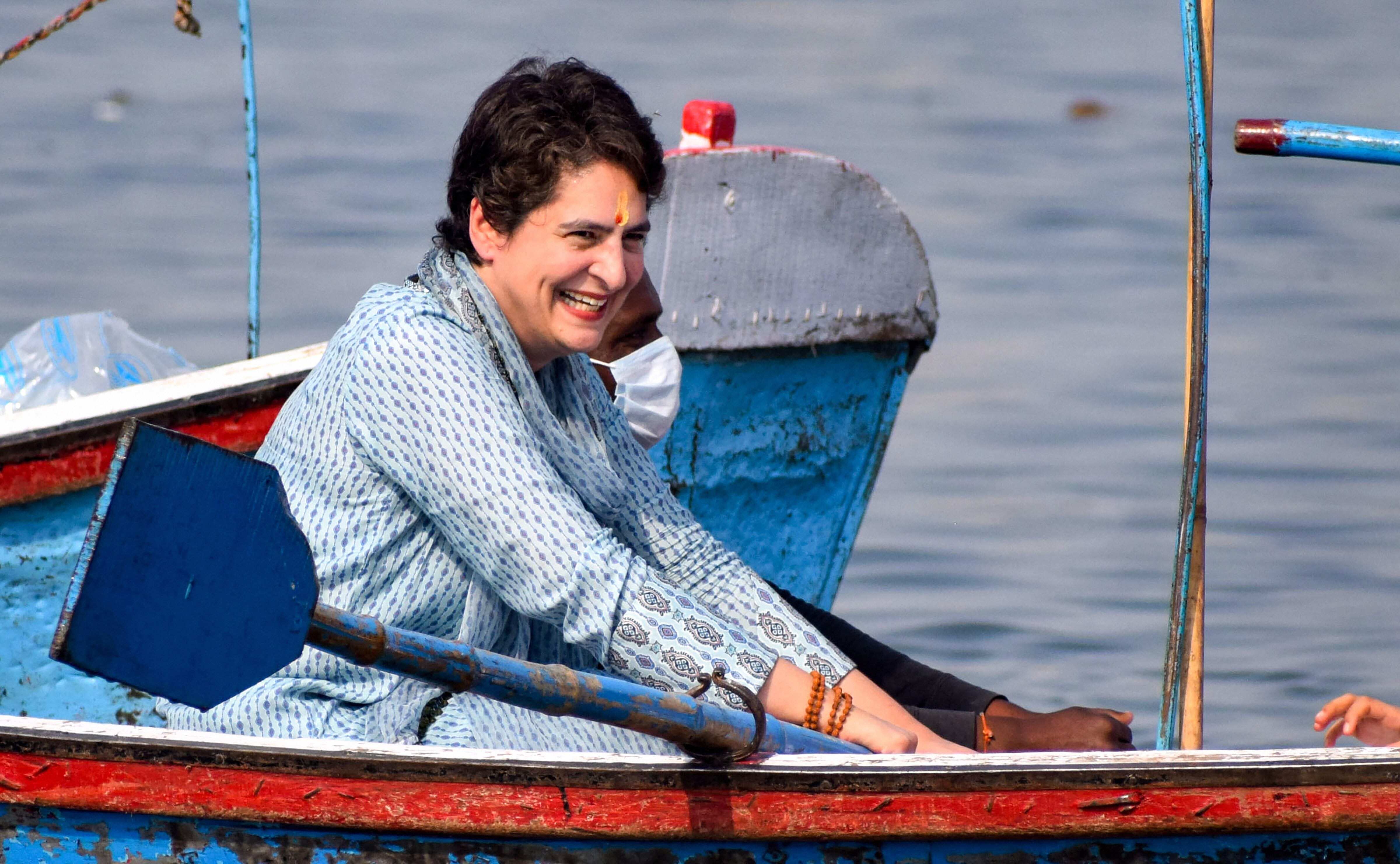 Congress leader Priyanka Gandhi Vadra rides on a boat after taking a holy dip in River Ganga on the occasion of 'Mauni Amavasya' during the ongoing 'Magh Mela', at Sangam in Prayagraj, Thursday, Feb. 11, 2021. (PTI)