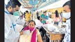 A health worker collects swab sample of a passenger at Dadar Terminus on Friday. (Satish Bate/HT Photo) A health worker collects swab sample of a passenger at Dadar Terminus on Friday. (Satish Bate/HT Photo)