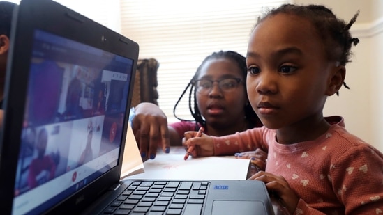 The CDC's phased mitigation strategy is intended to be adapted depending on the level of Covid-19 transmission in a school's community. (AP) The CDC's phased mitigation strategy is intended to be adapted depending on the level of Covid-19 transmission in a school's community. (AP)