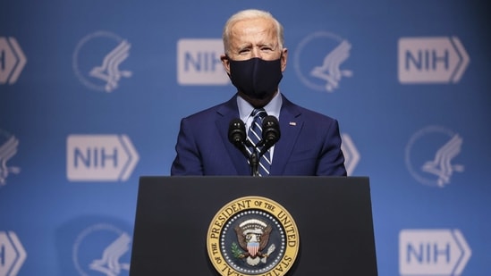 US President Joe Biden wears a protective mask while speaking at the National Institutes of Health (NIH) in Bethesda, Maryland, US on Thursday. (Bloomberg Photo) US President Joe Biden wears a protective mask while speaking at the National Institutes of Health (NIH) in Bethesda, Maryland, US on Thursday. (Bloomberg Photo)