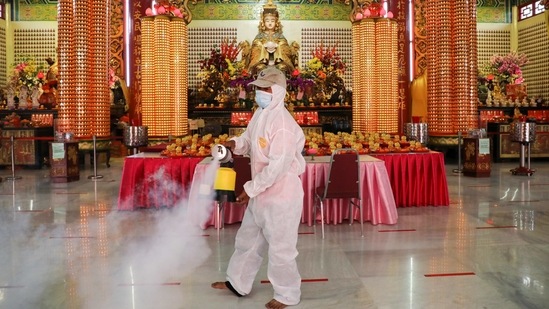 A worker disinfects Thean Hou Temple during Lunar New Year celebrations amid the coronavirus disease (COVID-19) outbreak in Kuala Lumpur, Malaysia on February 12.(Lim Huey Teng / REUTERS)