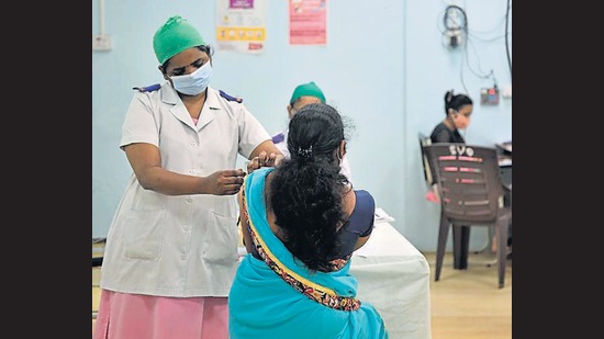 A Covid-19 vaccine shot being administered to a beneficiary at Rajawadi Hospital on Friday. (Satish Bate/HT Photo) A Covid-19 vaccine shot being administered to a beneficiary at Rajawadi Hospital on Friday. (Satish Bate/HT Photo)