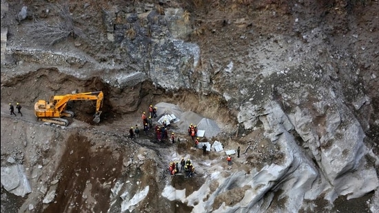 Rescue team members work during a relief operation at a destroyed bridge site after a flash flood swept down a mountain valley destroying dams and bridges, in Raini village in Uttarakhand (REUTERS) Rescue team members work during a relief operation at a destroyed bridge site after a flash flood swept down a mountain valley destroying dams and bridges, in Raini village in Uttarakhand (REUTERS)