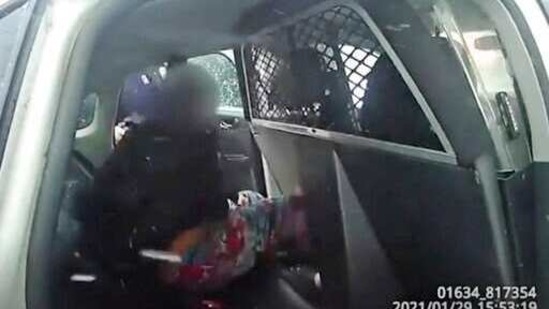 A 9-year-old Black girl is handcuffed in custody in a cruiser after police used pepper spray on her as she screamed for her father. (AP) A 9-year-old Black girl is handcuffed in custody in a cruiser after police used pepper spray on her as she screamed for her father. (AP)