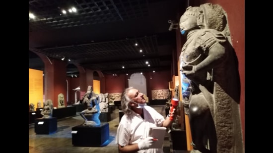 Anupam Sah, head of conservation at CSMVS, inspects an artefact during the lockdown. (Image courtesy CSMVS)