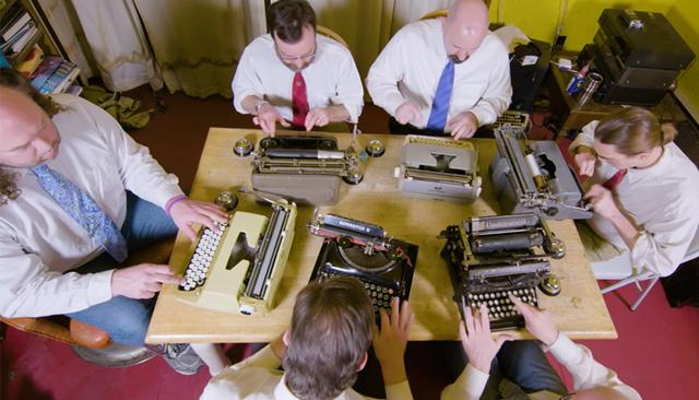 They always dress in formal work wear when playing, and the lyrics of their songs are satire about work culture too. They always dress in formal work wear when playing, and the lyrics of their songs are satire about work culture too.