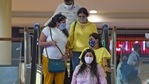 People wearing facemasks as a preventive measure against the Covid-19 coronavirus are seen inside a shopping mall in Thane on the outskirts of Mumbai. (AFP) People wearing facemasks as a preventive measure against the Covid-19 coronavirus are seen inside a shopping mall in Thane on the outskirts of Mumbai. (AFP)