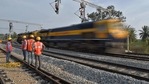 In this representative image, workers on contract for Indian Railways erect infrastructure for drawing electric cable lines over railway tracks for use by locomotives. (AFP) In this representative image, workers on contract for Indian Railways erect infrastructure for drawing electric cable lines over railway tracks for use by locomotives. (AFP)