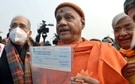 Treasurer of Ram Janmabhoomi Swami Govind Dev Giri Maharaj with committee head for Ram Mandir construction Nripendra Misra and VHP president Alok Kumar in this file picture from January 2021. (ANI Photo) Treasurer of Ram Janmabhoomi Swami Govind Dev Giri Maharaj with committee head for Ram Mandir construction Nripendra Misra and VHP president Alok Kumar in this file picture from January 2021. (ANI Photo)