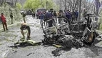 Security personnel inspect the mangled remains of a car which exploded near a CRPF convoy on the Jammu-Srinagar highway at Banihal, in Ramban district of Jammu and Kashmir, Saturday, March 30, 2019.(PTI) Security personnel inspect the mangled remains of a car which exploded near a CRPF convoy on the Jammu-Srinagar highway at Banihal, in Ramban district of Jammu and Kashmir, Saturday, March 30, 2019.(PTI)