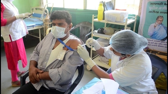 A frontline worker gets vaccinated in Kalyan. (Rishikesh Choudhary/HT photo)