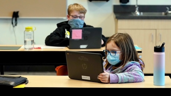 FILE - In this Feb. 2, 2021, file photo, students wear masks as they work in a fourth-grade classroom, at Elk Ridge Elementary School in Buckley, Wash. Amid mounting tensions about school reopening, the Centers for Disease Control and Prevention planned to release long-awaited guidance Friday, Feb. 12, 2021, on what measures are needed to get children back into the classroom during the pandemic. (AP Photo/Ted S. Warren, File) (AP) FILE - In this Feb. 2, 2021, file photo, students wear masks as they work in a fourth-grade classroom, at Elk Ridge Elementary School in Buckley, Wash. Amid mounting tensions about school reopening, the Centers for Disease Control and Prevention planned to release long-awaited guidance Friday, Feb. 12, 2021, on what measures are needed to get children back into the classroom during the pandemic. (AP Photo/Ted S. Warren, File) (AP)