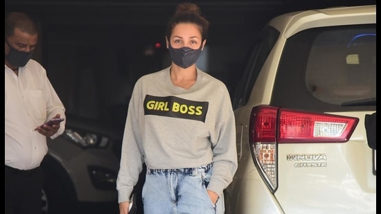 Malaika Arora in a girlboss sweatshirts with faded denims (Viral Bhayani)