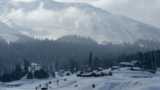 A view of snow-covered mountains and houses in a ski resort in Gulmarg, Srinagar, on January 25, 2021. (AFP) A view of snow-covered mountains and houses in a ski resort in Gulmarg, Srinagar, on January 25, 2021. (AFP)