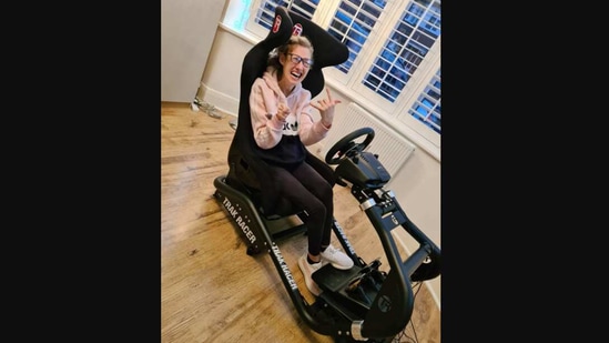 The image shows Hannah Cheetham in her new car simulator chair.(Instagram/@cheethamswithdreams)