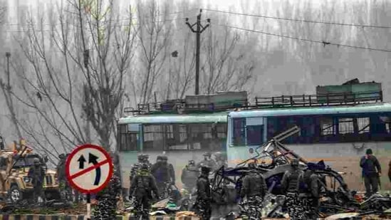 Security personnel carry out the rescue and relief works at the site of suicide bomb attack at Lathepora Awantipora in Pulwama district of south Kashmir, Thursday, February 14, 2019. At least 30 CRPF jawans were killed and dozens other injured when a CRPF convoy was attacked.(PTI)