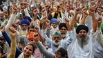 Farmers shout slogans at the site during their ongoing protest against farm laws at Delhi-Ghazipur border, in Delhi on Saturday. (ANI Photo) Farmers shout slogans at the site during their ongoing protest against farm laws at Delhi-Ghazipur border, in Delhi on Saturday. (ANI Photo)