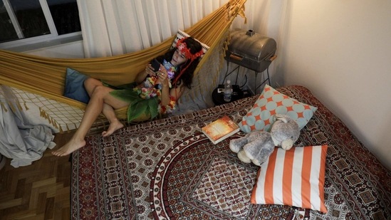 Architect Helena Schmidt, 37, lounging in her Carnival costume in Rio de Janeiro on February 10. "It is a not ending sadness, we lose the happiness we have to move on all the year, without the carnival we lose the beauty, the child side of people. It is when we forget all the problems, so we miss something in the city without the Carnival", Schmidt said.(Ricardo Moraes / REUTERS)