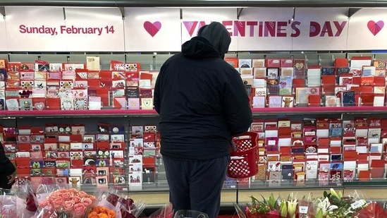 A shopper at a Chicago area store looks over Valentine's Day cards Saturday, Feb. 13, 2021.( AP)