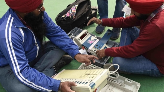 Election officials check Electronic Voting Machines (EVMs) at a distribution centre in Amritsar on Saturday, ahead of municipal elections in Punjab. (AFP Photo) Election officials check Electronic Voting Machines (EVMs) at a distribution centre in Amritsar on Saturday, ahead of municipal elections in Punjab. (AFP Photo)