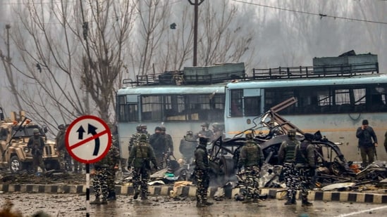 In this file picture from February 14, 2019, security personnel are seen carrying out the rescue and relief works at the site of suicide bomb attack at Lathepora, Awantipora in Pulwama district of south Kashmir.(PTI Photo/File)