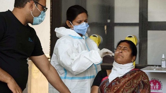 A medic collects a swab sample from a woman to test for coronavirus infection at Gardiner Hospital, in Patna, Bihar in this file picture. (Santosh Kumar/ Hindustan Times) A medic collects a swab sample from a woman to test for coronavirus infection at Gardiner Hospital, in Patna, Bihar in this file picture. (Santosh Kumar/ Hindustan Times)