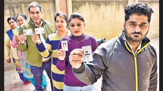 Voters lined up to cast their votes outside a polling station at Khanna in Ludhiana district on Sunday. (Gurpreet Singh/HT) Voters lined up to cast their votes outside a polling station at Khanna in Ludhiana district on Sunday. (Gurpreet Singh/HT)
