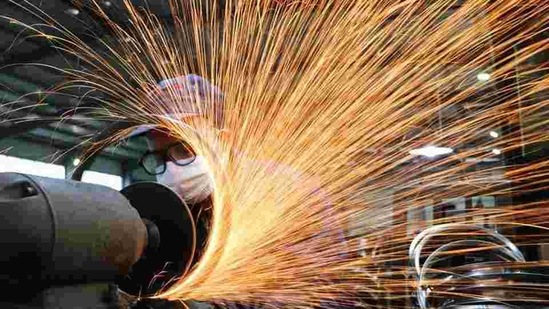 A worker wearing a face mask works on a production line manufacturing bicycle steel rim at a factory in Hangzhou, Zhejiang province, China. (Reuters/ File photo) A worker wearing a face mask works on a production line manufacturing bicycle steel rim at a factory in Hangzhou, Zhejiang province, China. (Reuters/ File photo)