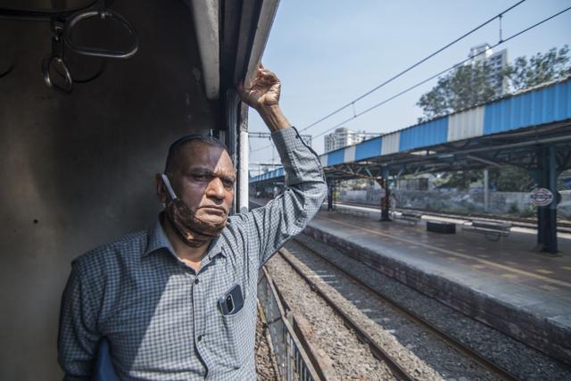 Nirmal Jain on-board a train crossing Lower Parel station. (Pratik Chorge/HT PHOTO)