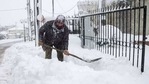 Panagiotis Economou shovels snow from the entrance of his property during heavy snowfall, in the village of Kapandriti, Greece, February 15, 2021. REUTERS/Alkis Konstantinidis(REUTERS)