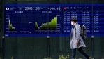 A man looks at screens showing Japan's Nikkei 225 index at a securities firm in Tokyo. (AP Photo) A man looks at screens showing Japan's Nikkei 225 index at a securities firm in Tokyo. (AP Photo)