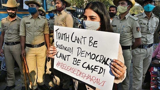 A woman holding a placard during a protest against the arrest of climate activist Disha Ravi in Bengaluru. (Reuters) A woman holding a placard during a protest against the arrest of climate activist Disha Ravi in Bengaluru. (Reuters)
