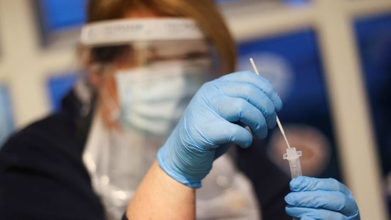 A nursery staff member at Little Stars Childcare holds a swab stick as she takes part in the Staffordshire County Council's pilot testing initiative to allow nurseries to test staff weekly, amidst the spread of the coronavirus disease (COVID-19), in Newcastle-under-Lyme, Staffordshire, Britain February 15, 2021. REUTERS/Carl Recine (REUTERS)