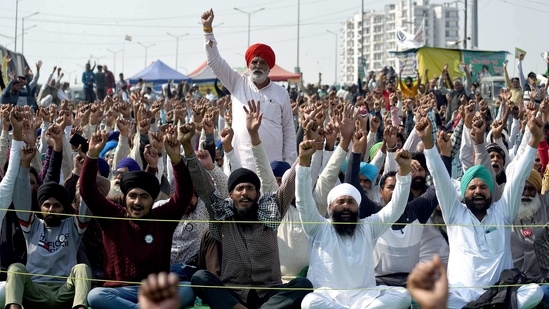 Farmers shouting slogans at the demonstration site during the ongoing farmer protest against the new farm laws at Ghazipur Border, in New Delhi.