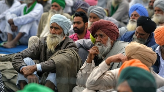 Farmers sitting at Tikri Border during their ongoing protest against the farm laws, in New Delhi on Sunday. (ANI Photo)