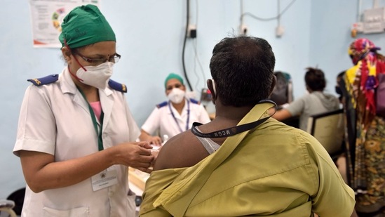A beneficiary is vaccinated against Covid-19 at Rajawadi Hospital in Mumbai on February 12. “Mumbai could get into trouble with local trains starting and flow of people increasing from its surrounding areas. The numbers were expected to rise as people are lax in Covid-appropriate behavior,” Dr Subhash Salunkhe, advisor to the state government on Covid-19 told HT.(Satish Bate / HT Photo)