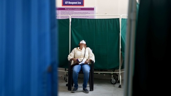A Covid-19 vaccine beneficiary rests in the AEFI management area at Rajawadi Hospital in Mumbai on February 12. Dr Salunkhe added that the vaccination drive is progressing slowly and it will take time for herd immunity to build after inoculation.(Satish Bate / HT Photo)