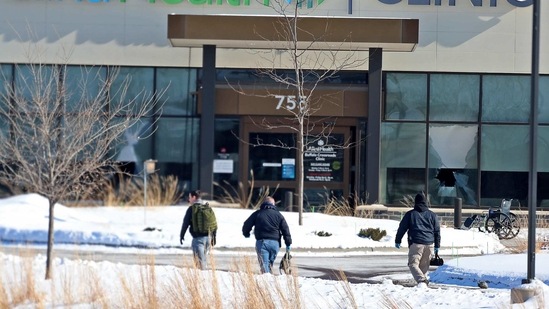 In this Tuesday, Feb. 9, 2021 file photo, law enforcement personnel walk toward the Allina Health clinic where multiple people were shot in Buffalo, Minnesota. Doctors say they're facing increasing threats of violence for refusing to prescribe opioids or trying to wean patients off the addictive painkillers. The issue was underscored by Tuesday's shooting at the Minnesota clinic.(AP) In this Tuesday, Feb. 9, 2021 file photo, law enforcement personnel walk toward the Allina Health clinic where multiple people were shot in Buffalo, Minnesota. Doctors say they're facing increasing threats of violence for refusing to prescribe opioids or trying to wean patients off the addictive painkillers. The issue was underscored by Tuesday's shooting at the Minnesota clinic.(AP)