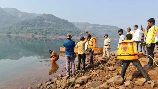 A disaster management team retrieving the bodies of two students from the backwaters of Varasgaon dam (HT PHOTO)